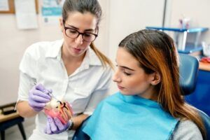 A doctor is explaining the dental exam result to her patient in Scottsdale, AZ.
