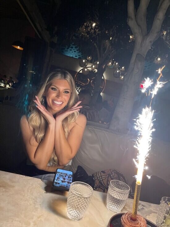 Patient smiling with bright teeth next to sparkler Scottsdale AZ