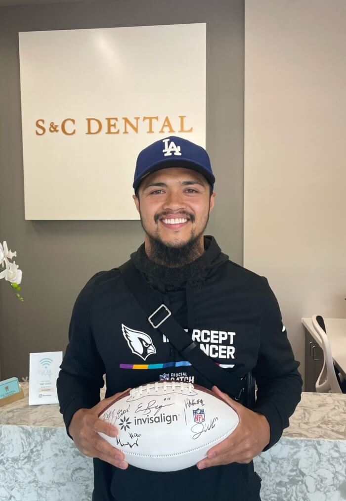 Rugby player who got an Invisalign at S&C dental clinic in Scottsdale, AZ