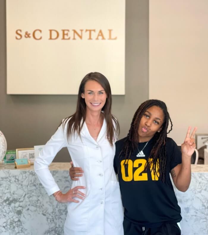 Two women stand outside S&C Dental in Scottsdale, AZ