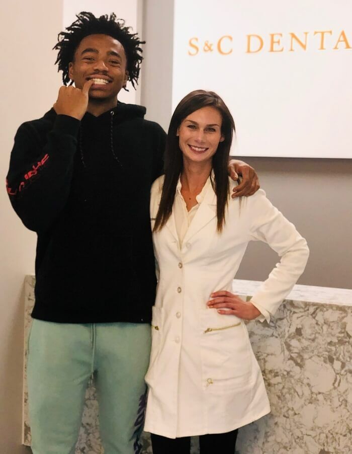 S&C dentist posing with a patient at their dental clinic in Scottsdale, AZ