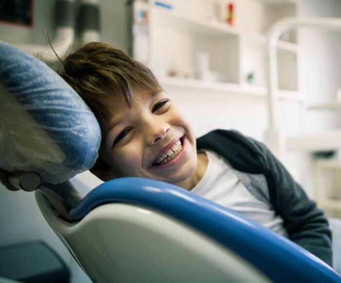 Smiling Boy at a Dentist Office - S&C Dental