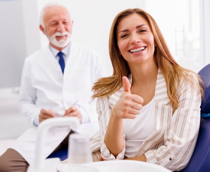 Woman after oral screenings at dentist clinic